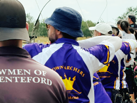 Archers on the shooting line from Darenteford in black or white, and Crown in purple.