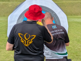 Fox and Darenteford archers check their arrow scores