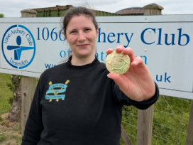 Ruth shows off her medal at 1066 Archery Club