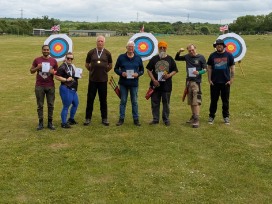 Attendees post with their course certificates.