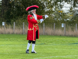 A town crier presents the awards