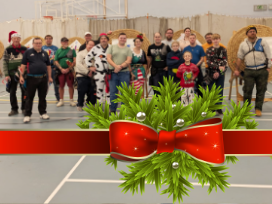 Archers dressed-up for Christmas, on the indoor fun shoot range.